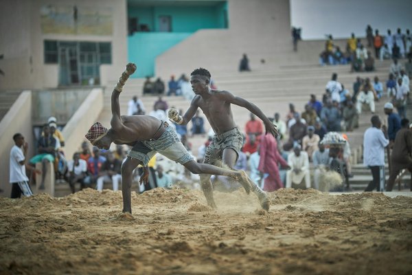 How can football coaches effectively rotate their squad during a congested fixture period?