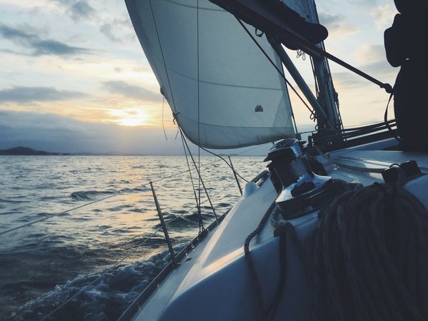 How should a beginner in competitive sailing prepare for their first regatta?