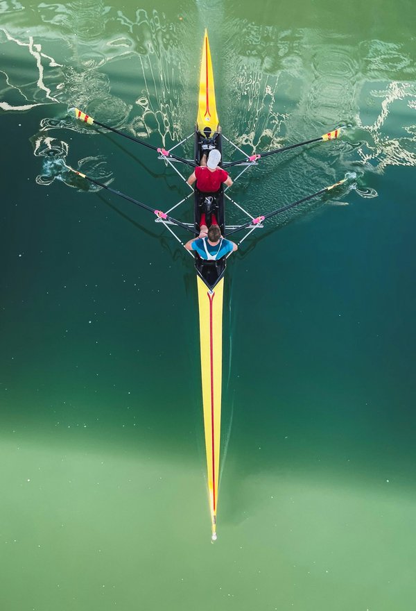 How can UK rowing clubs implement effective team cohesion techniques?